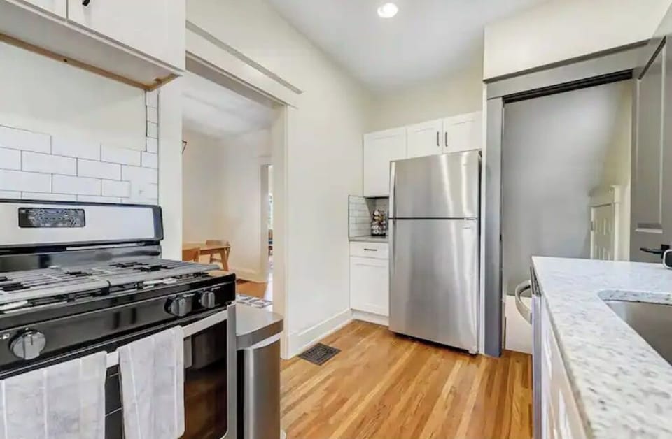 Kitchen w/ backdoor to the outdoor deck