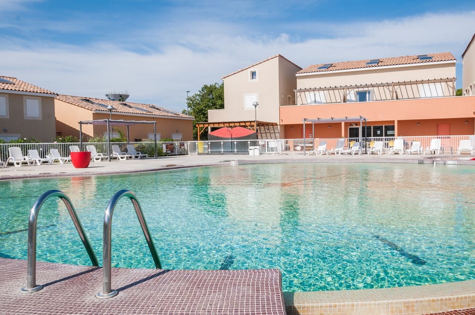 Lounge by the pool in the sunshine.