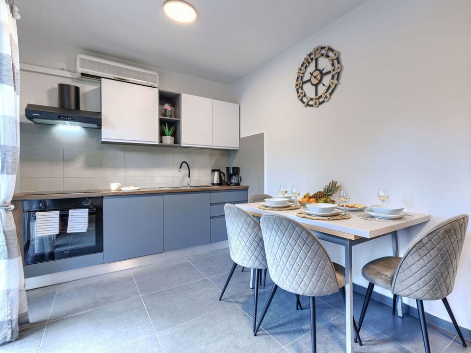 Interior Design, Furniture, Flooring, Ceiling, Kitchen, Countertop, Floor, Room, Lighting, Cabinetry