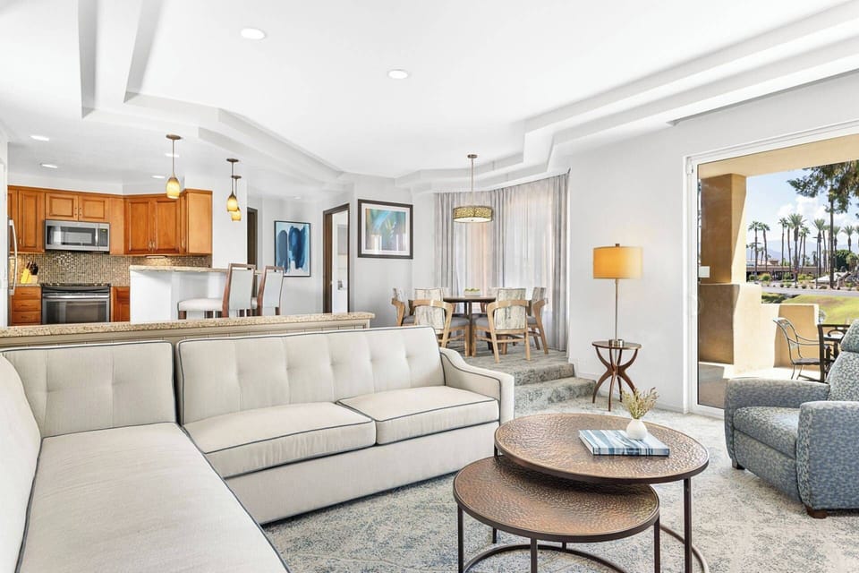 Spacious villa with a dining table and extra seating at the bar top.