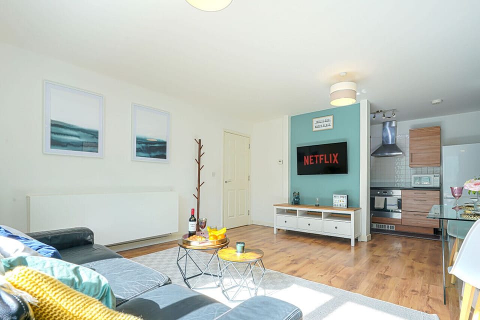 Sit back and relax in the living room equipped with a large 50'' Smart TV and a comfortable 3 seater sofa