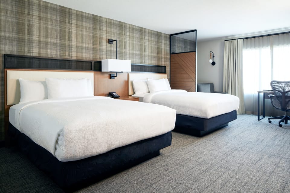 Hypo-allergenic bedding, pillowtop beds, desk, laptop workspace