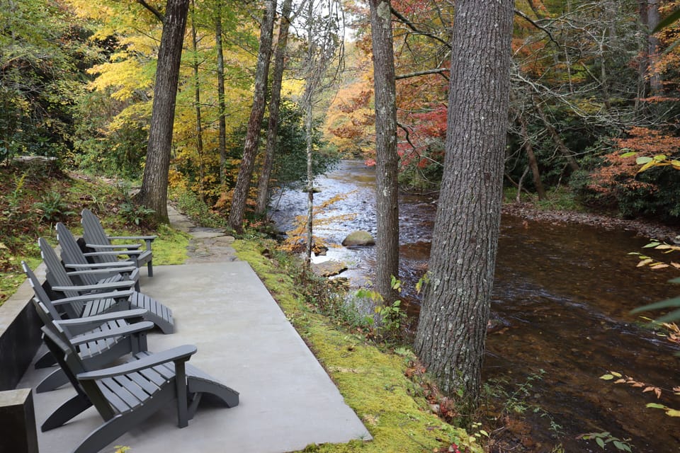 Patio by the river, steps from the house
