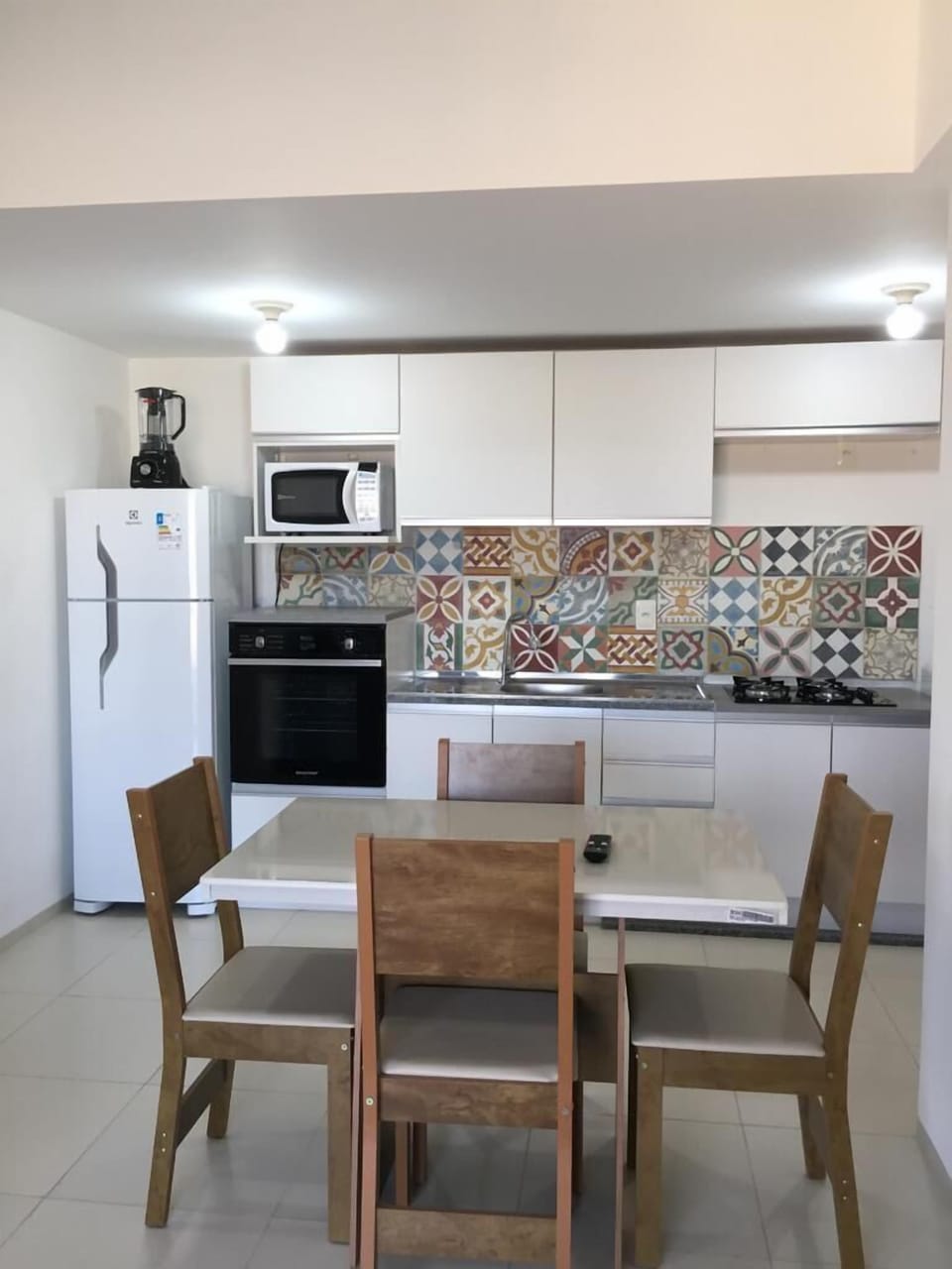 Stovetop, mixer, toaster oven, dining tables