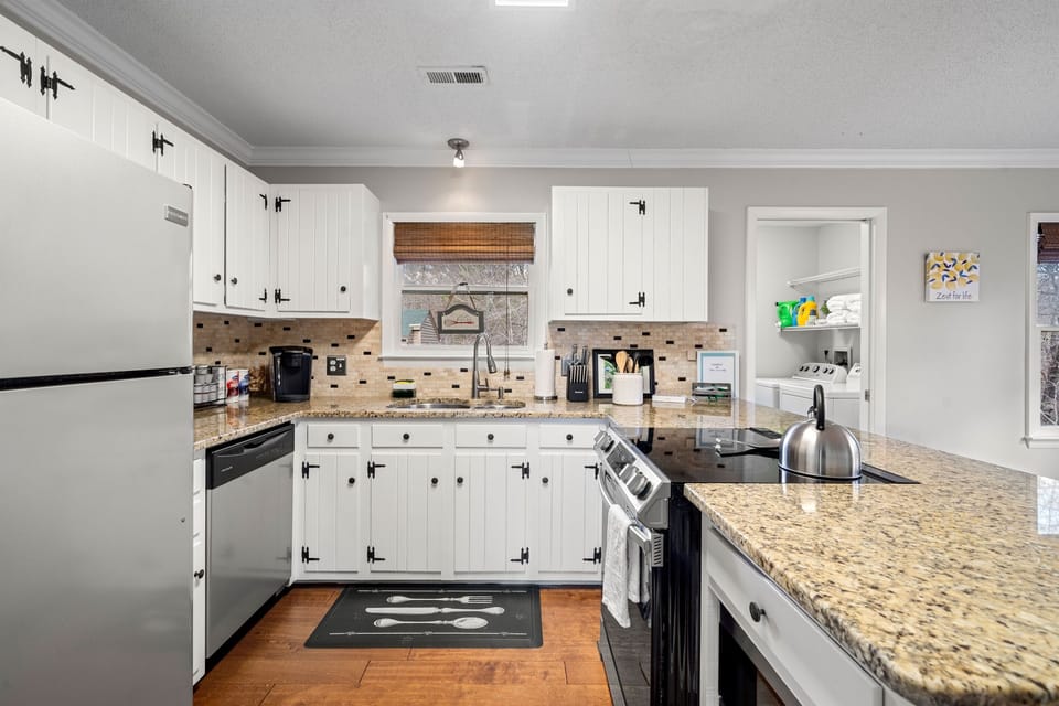 Fully stocked kitchen including Keurig coffee machine, toaster oven