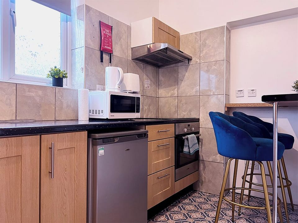 Triple Studio | Private kitchen | Fridge, electric kettle