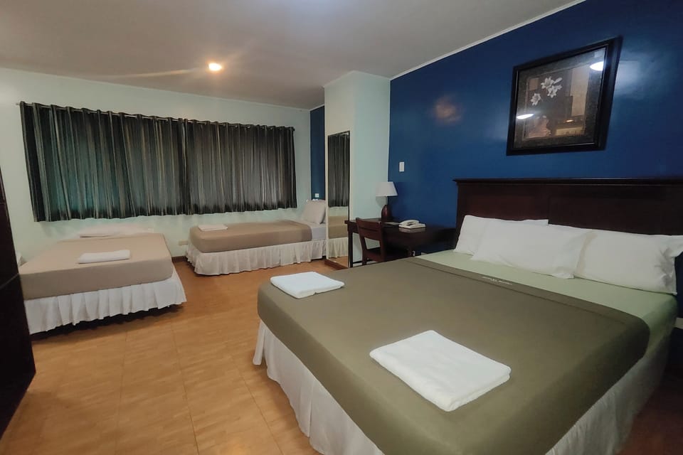 Family Room | Premium bedding, desk, free WiFi, bed sheets