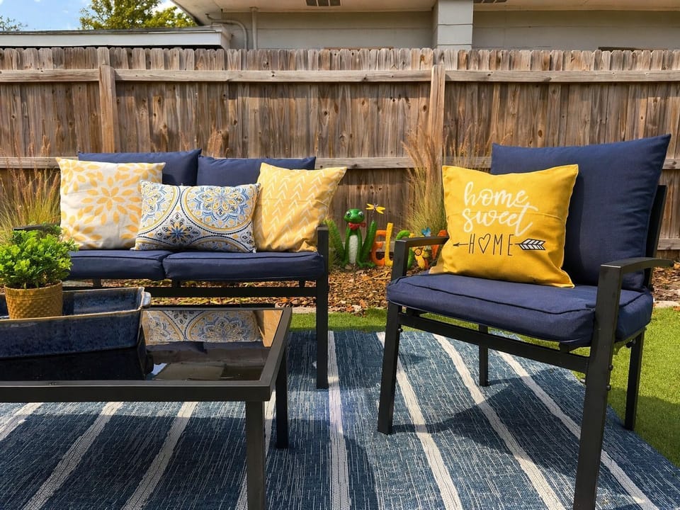 Cozy outdoor lounge with comfy seating, perfect for relaxing under the sun ☀️