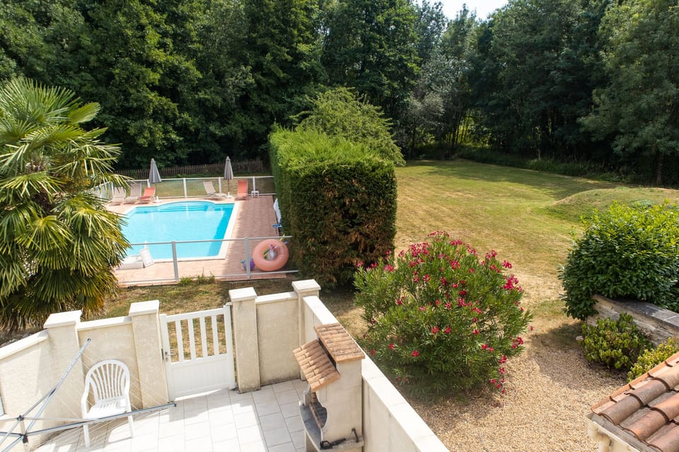 View of pool and surrounding woodland