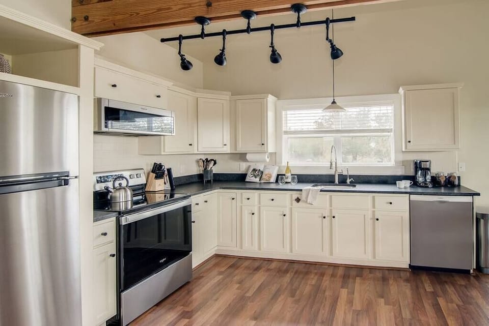 Full Kitchen complete with dishware, cooking utensils and pots/pans