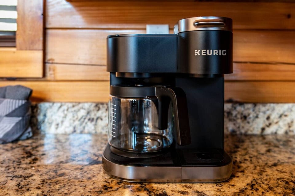 Keurig Duo coffee maker provides option for standard coffee or K-cups. A second coffee bar is located in the upstairs game room area.
