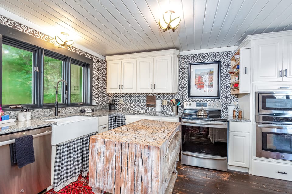Farmhouse style kitchen with new electric stove, built in air fryer. Two ovens.