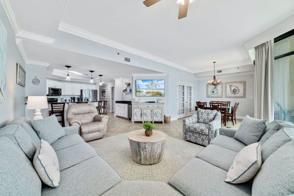 The heart of the home, beautifully executed. Enjoy the comfort of the large sectional in this open-space floor plan, linking the living area, dining table, and gourmet kitchen for easy vacation living.