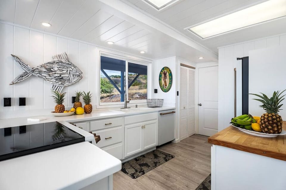 Fully-equipped kitchen on the main house's first floor provides a convenient and functional cooking space.
