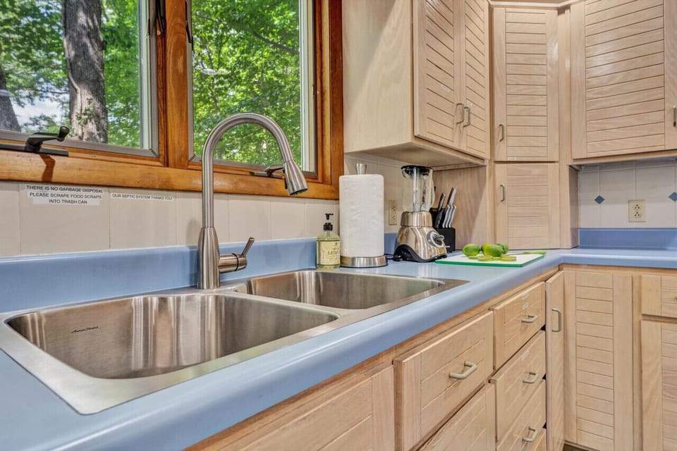 Our kitchen offers a sleek design and all the utensils you need for a home-cooked meal.