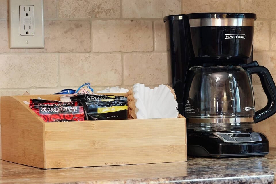 Our coffee bar is stocked with a few packages of ground coffee, filters, cream and sugar.  BUT...we still highly recommend you check out a local coffee shop while you are in town - Tempest and/or Copper Rock are our favorites!