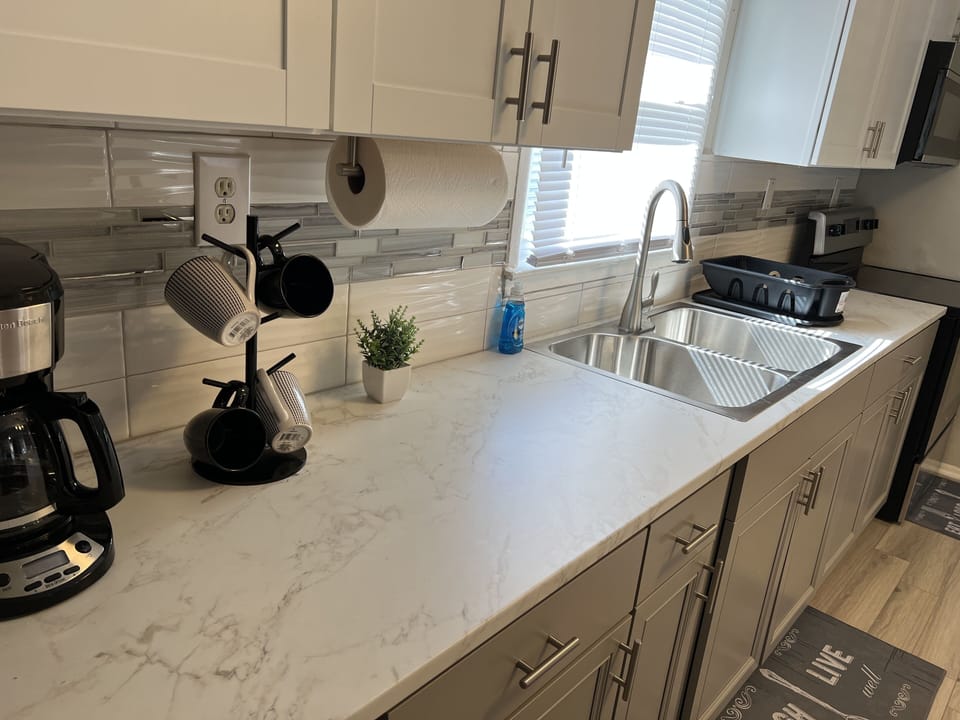 Enjoy your morning cup of coffee while making breakfast in this clean kitchen!