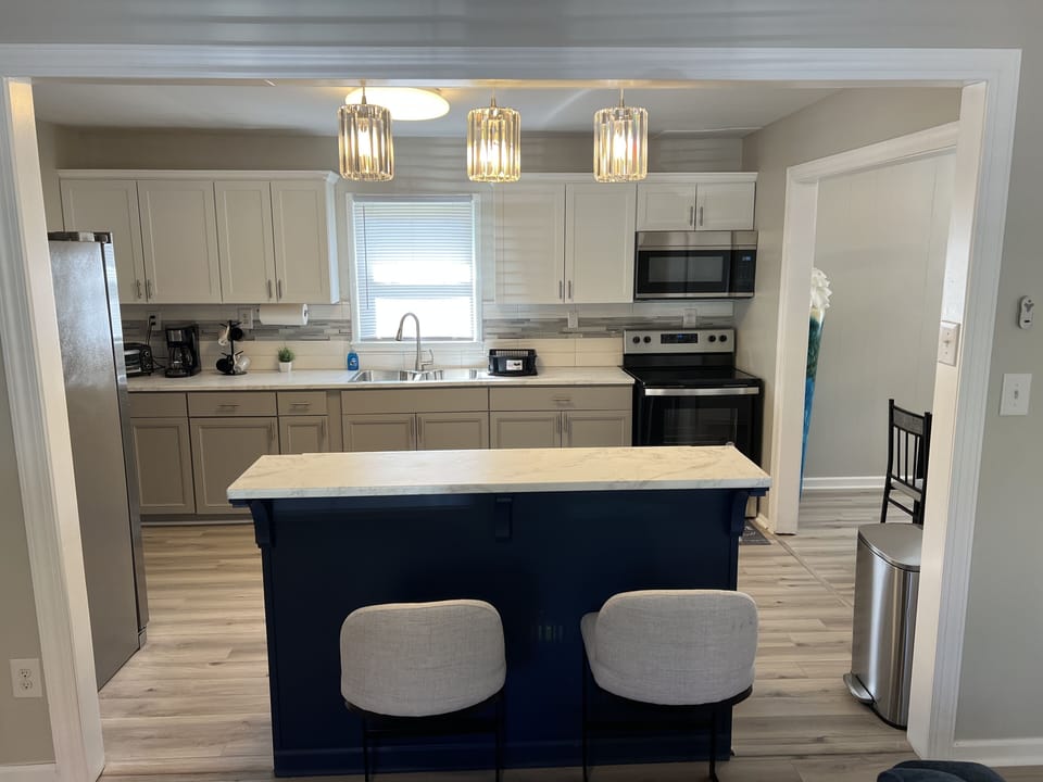 Ample counter space is available including a marble island counter