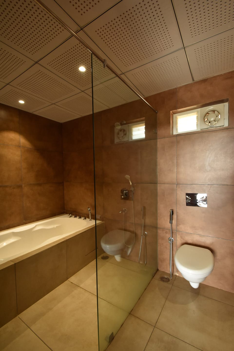 Luxury Studio Suite | Bathroom | Shower, rainfall showerhead, hair dryer (on request), towels
