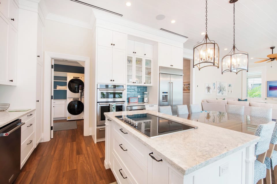 Large kitchen with dining room table.