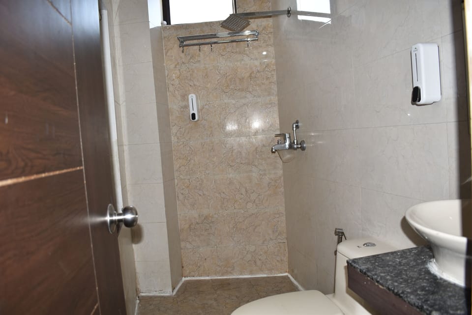 Economy Double Room, 2 Bedrooms, City View | Bathroom | Shower, slippers, towels