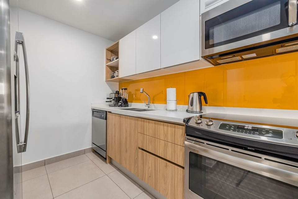 Refresh in your bright, modern bathroom with a spacious walk-in shower and fresh towels awaiting your arrival.