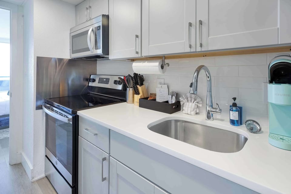 Modern kitchen with stainless steel appliances, perfect for cooking up a storm. 