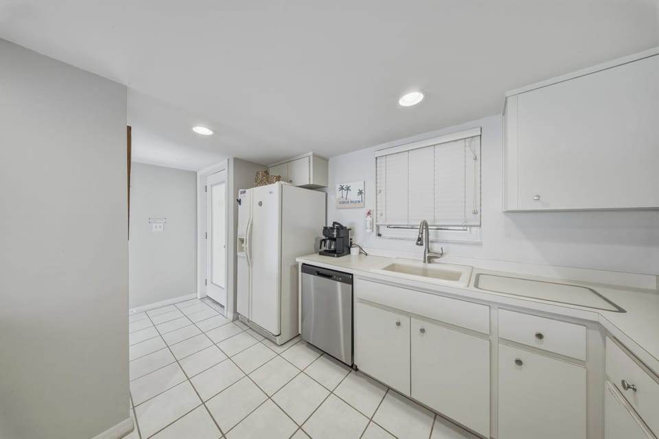Featuring abundant cabinetry, ample counter space, and modern appliances, this kitchen offers everything needed for family meals and extended stays.