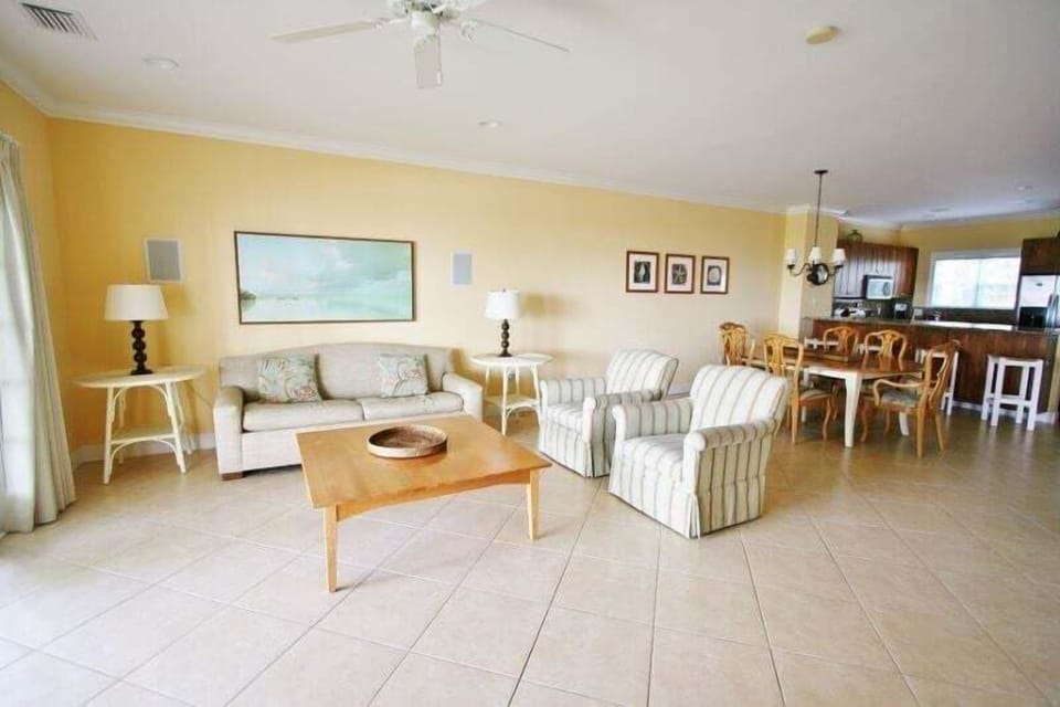 Experience an open-concept layout seamlessly connecting the kitchen, living room, and dining area, flooded with ample natural light.