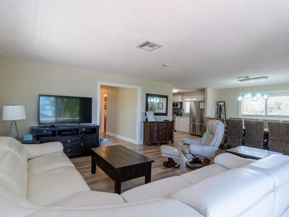 Open-concept living with comfortable seating and plenty of natural light.