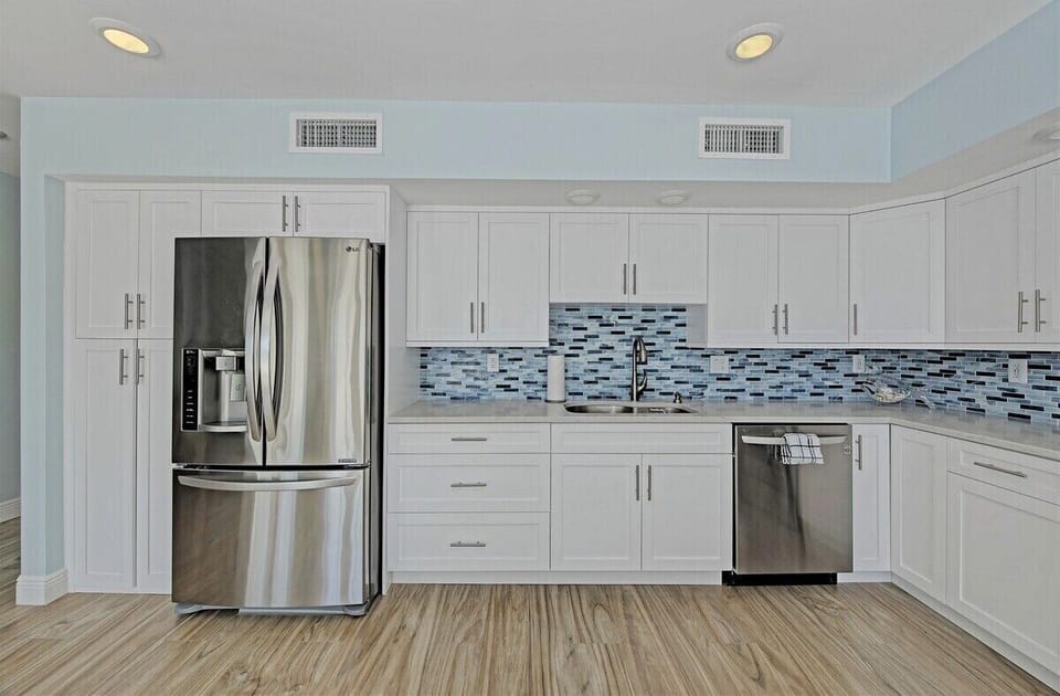 Stylish kitchen with stainless steel appliances and everything needed for preparing memorable meals.