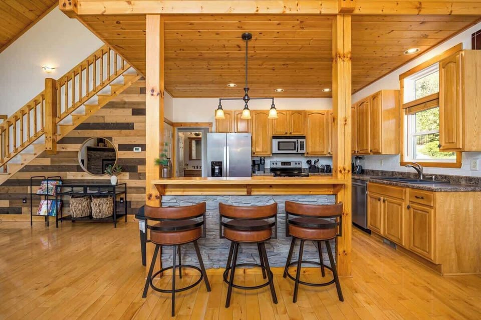 Charming open layout with stunning wood accents and modern appliances for memorable meals!