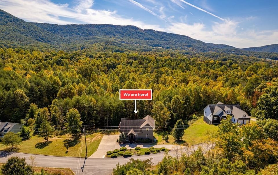 Stunning mountain views envelop this charming property in lush greenery!