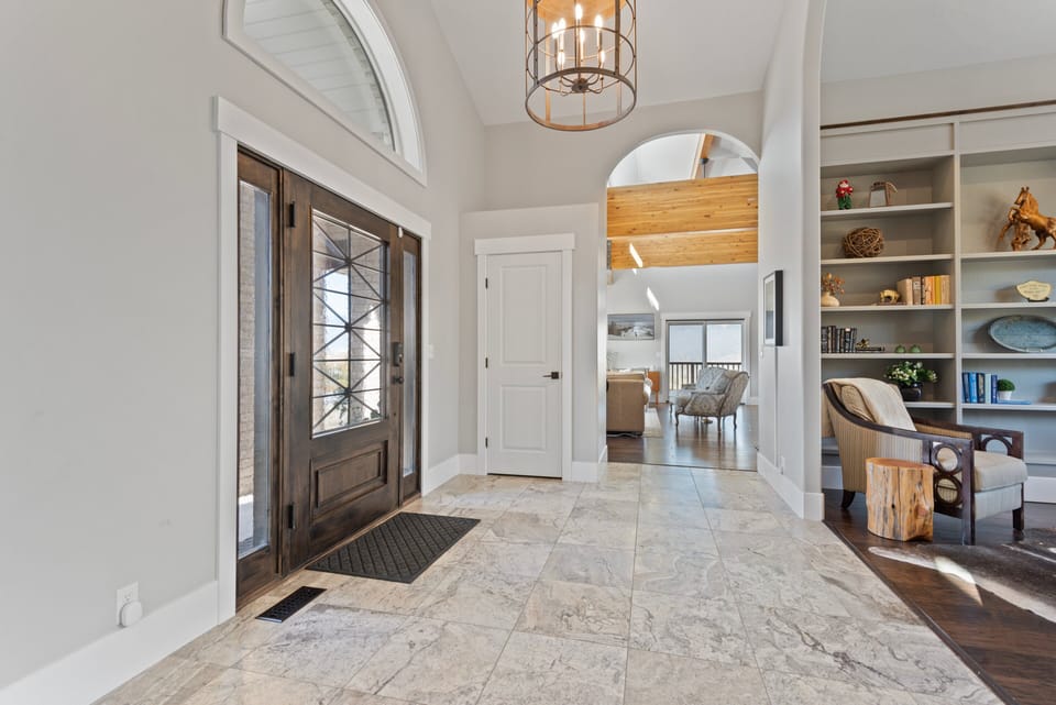Greet family and friends as they enter through the massive custom door