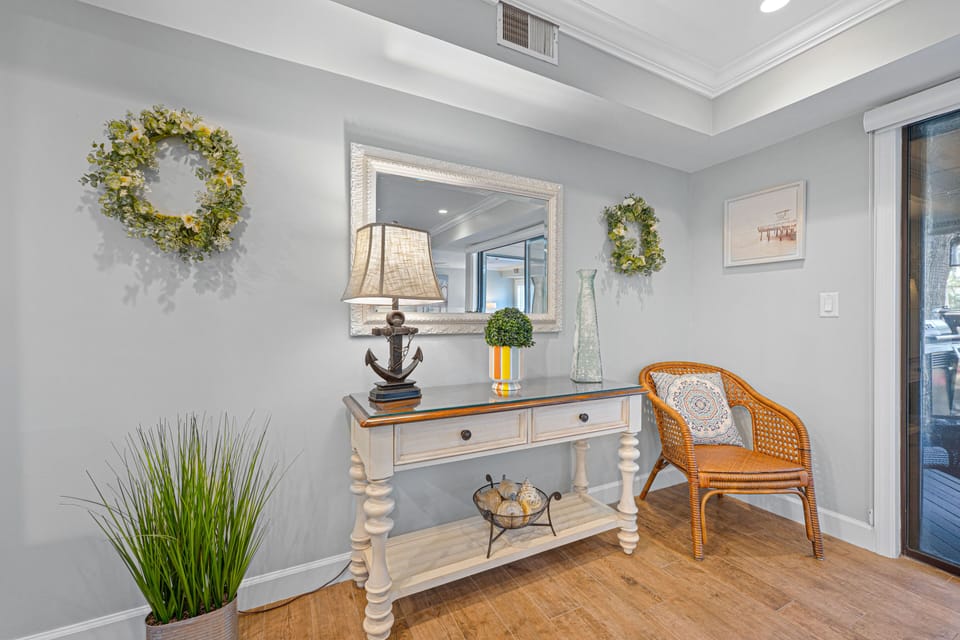A welcoming entryway sets the tone with coastal charm and thoughtful details, creating an inviting first impression.