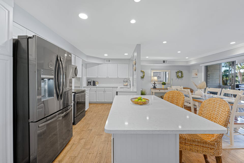 The open layout flows seamlessly into adjacent living areas, making it ideal for gathering with family and friends.