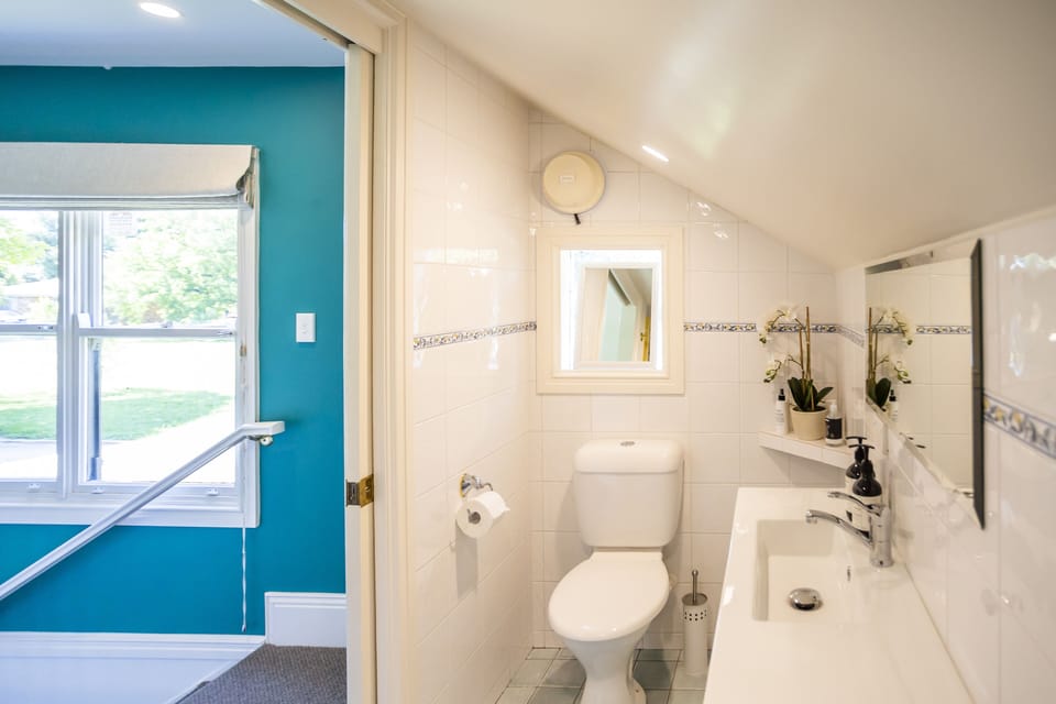 The bathroom is equipped with a roomy shower. 