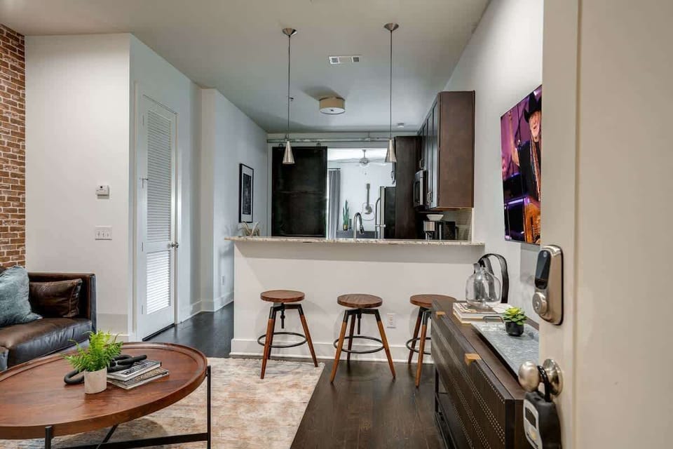 Urban style living room with designer furnishings and flat screen TV.