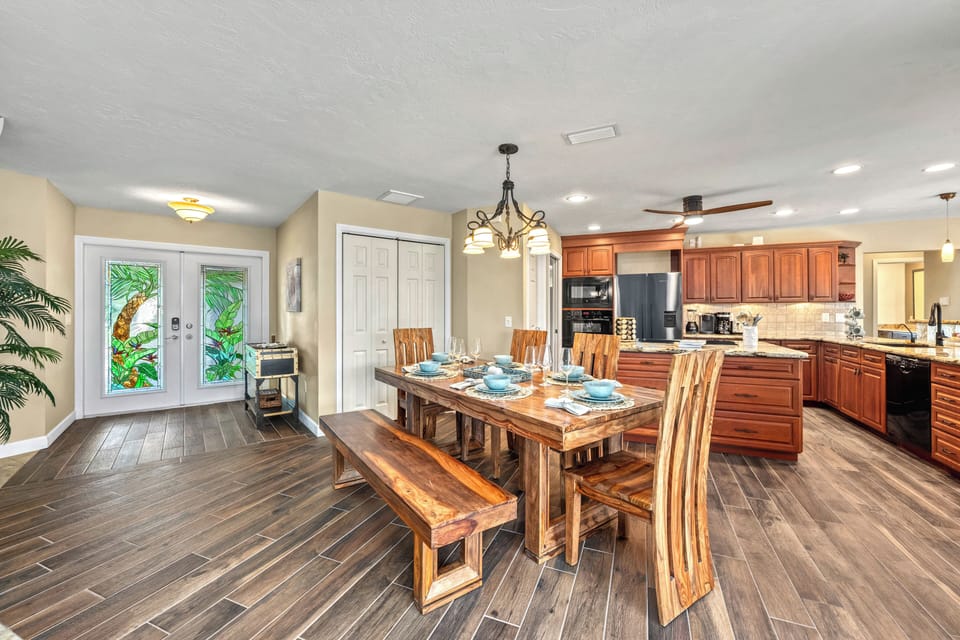 You gather around the dining table while staying connected to the bright foyer and open kitchen, making every moment feel together and effortless.