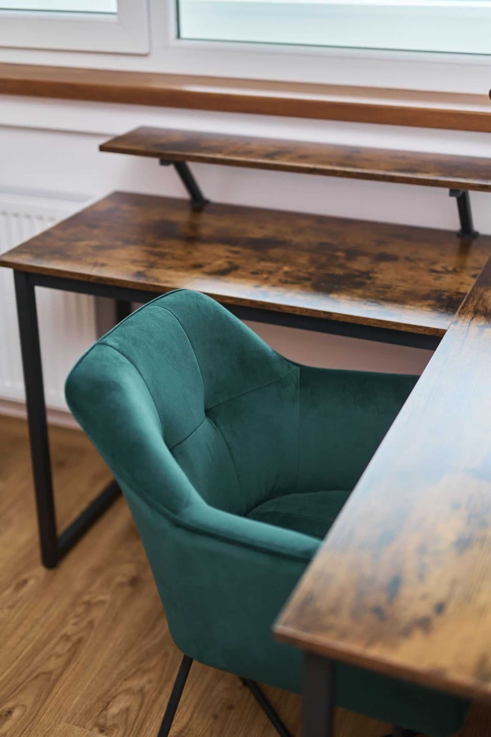 A place for remote work with a comfortable chair and a wooden table, perfect for working or eating.
