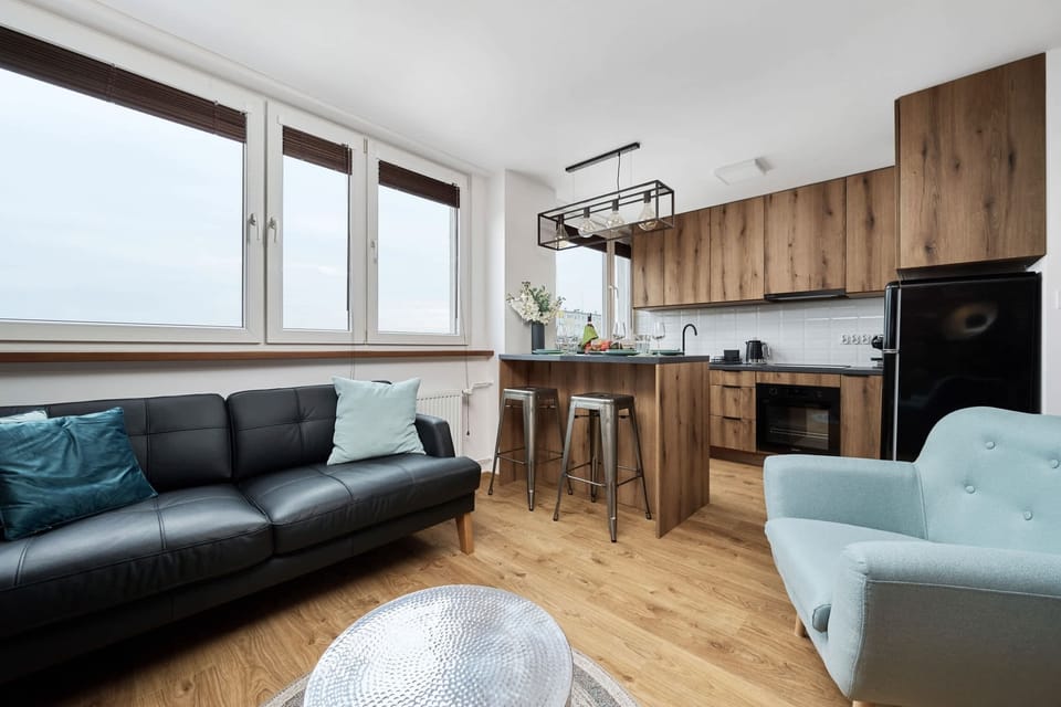 A different angle of the living room, showcasing a comfortable seating area and stylish decor.
