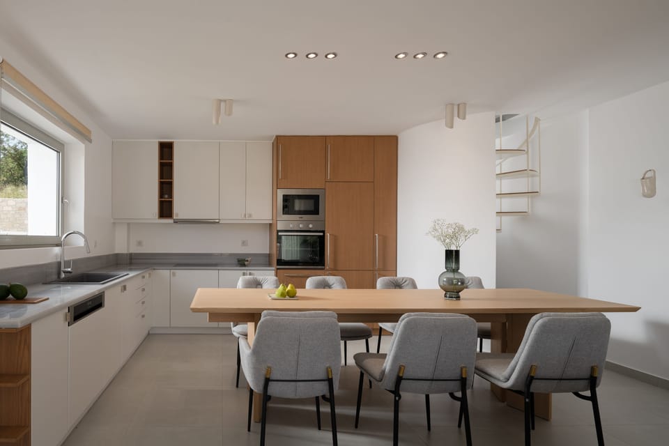 The open plan kitchen-dining area.