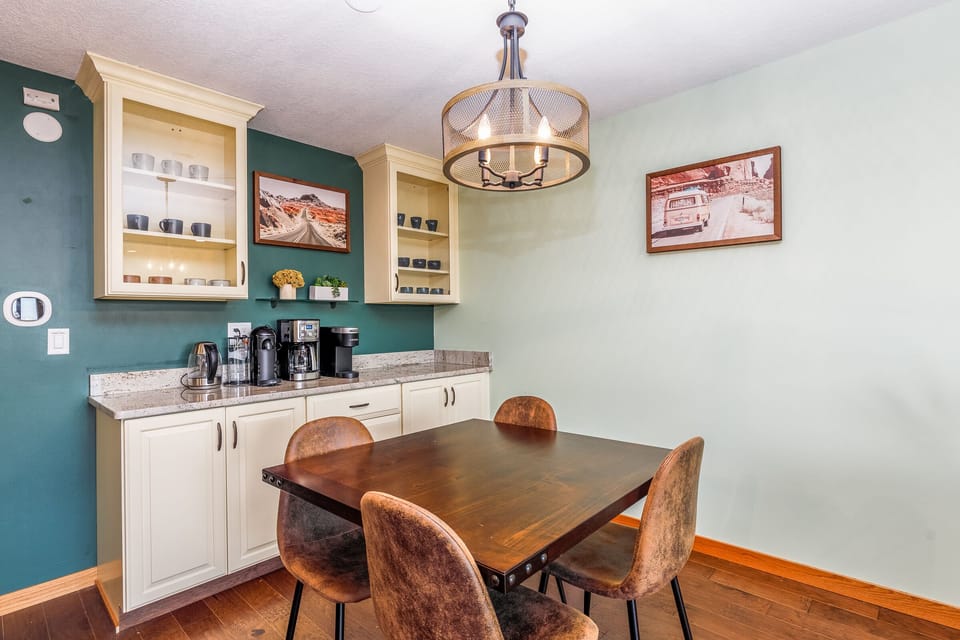 Dining room table with beverage bar nearby