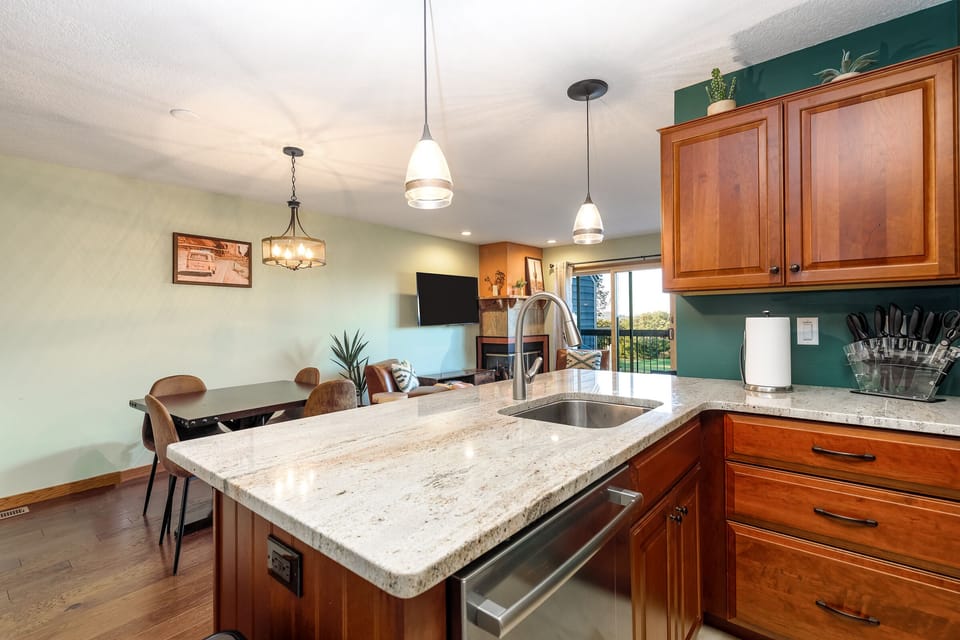 Kitchen looking into living room and dining room