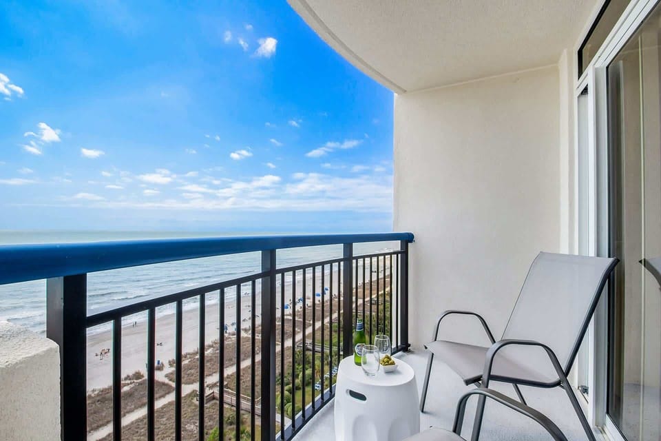  Wake up to stunning sunrise views from your private balcony. Relax in cozy chairs, sip your morning coffee, and soak in the breathtaking coastal scenery.