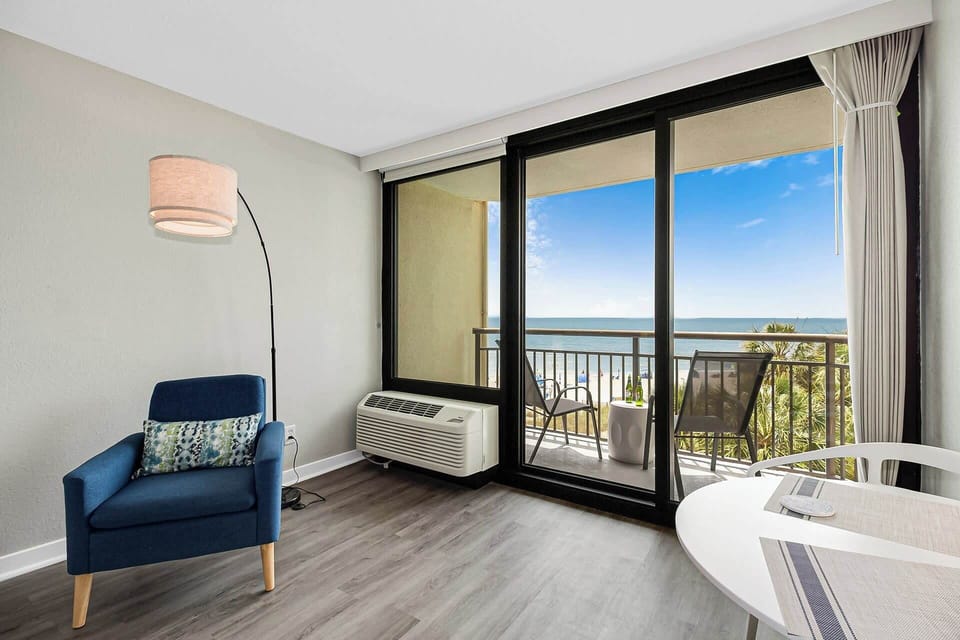Whether you're streaming a movie or soaking up the ocean view, this bright and airy room offers comfort, entertainment, and coastal charm all in one relaxing space.