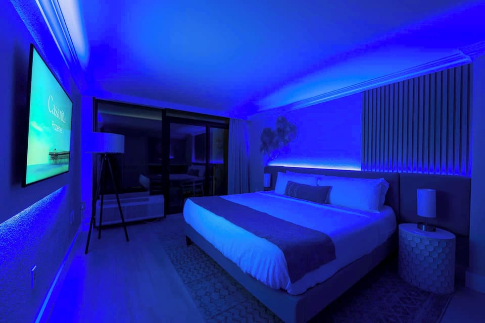 Relax in a modern and stylish room with customizable mood lighting.
