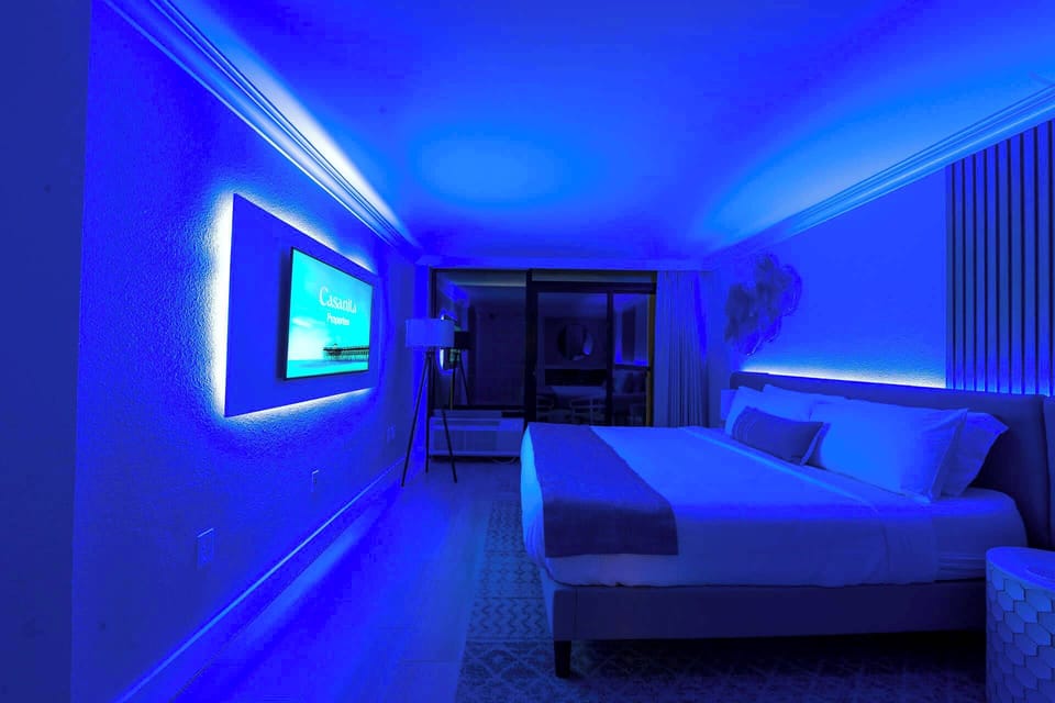 Relax in a modern and stylish room with customizable mood lighting.
