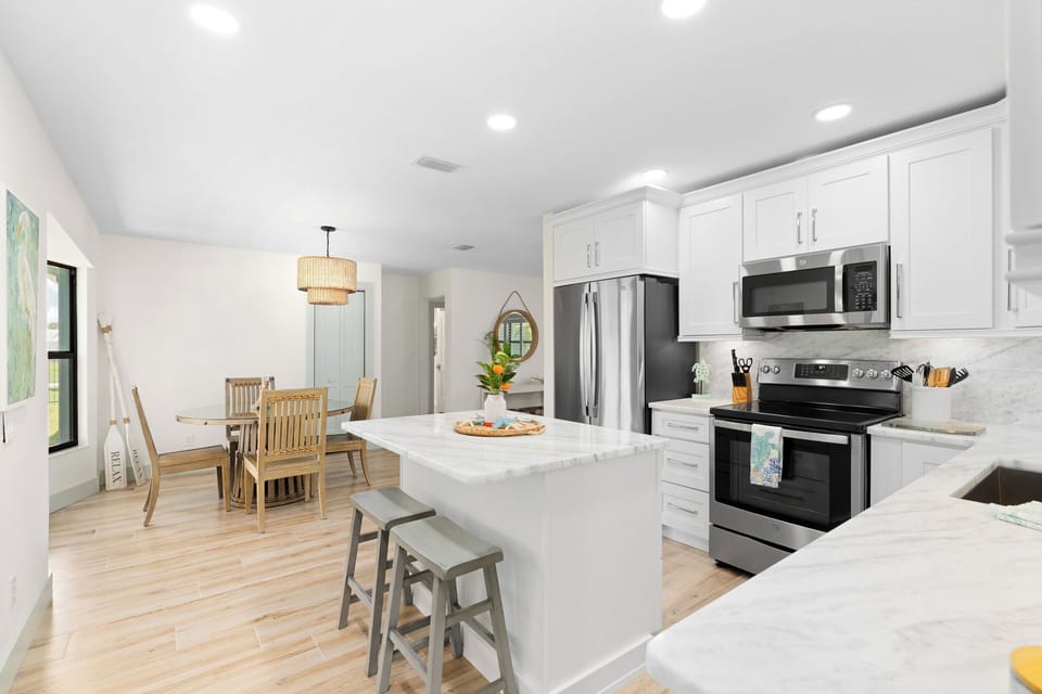 Kitchen with seating bar and dining area