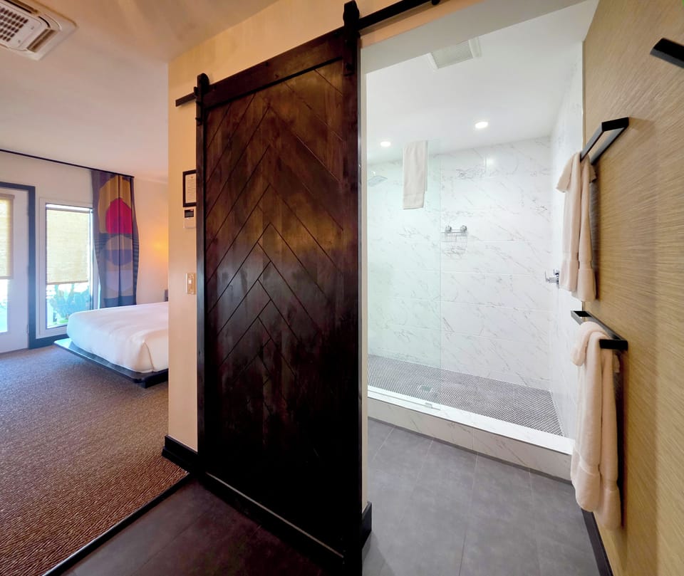 Pool View | Bathroom | Shower, rainfall showerhead, designer toiletries, hair dryer